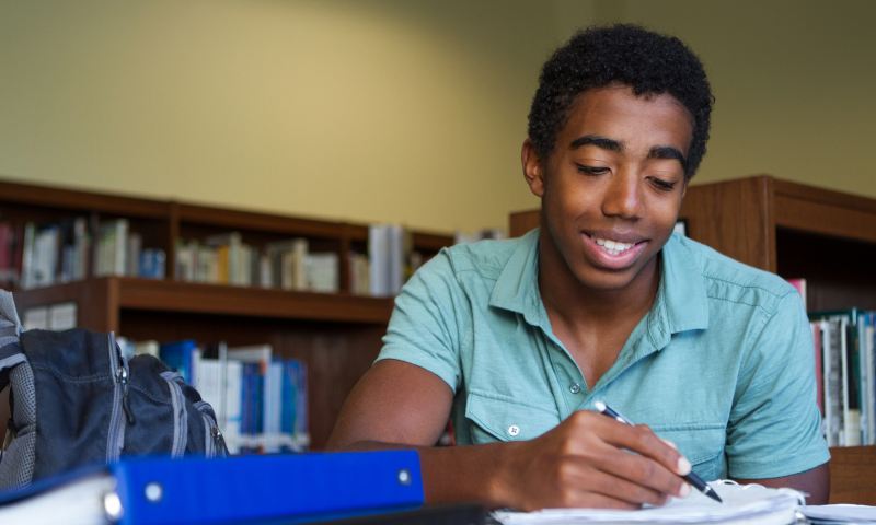 African American teenager studying