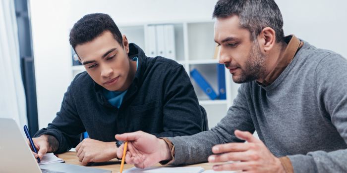 High school student meets with one of his mentors during the college application process.