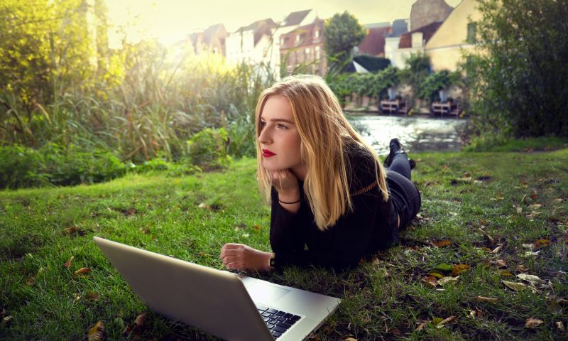 Girl in the park with a laptop
